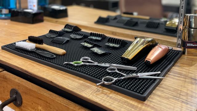 Rustic table with barbershop tools laid out