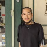 Kevin leaning by the doorway