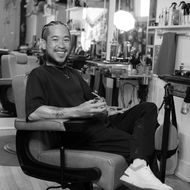 Kevin Nguyen headshot holding scissors in the foreground