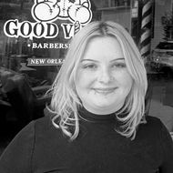 Olivia Commagere standing outside of the barbershop